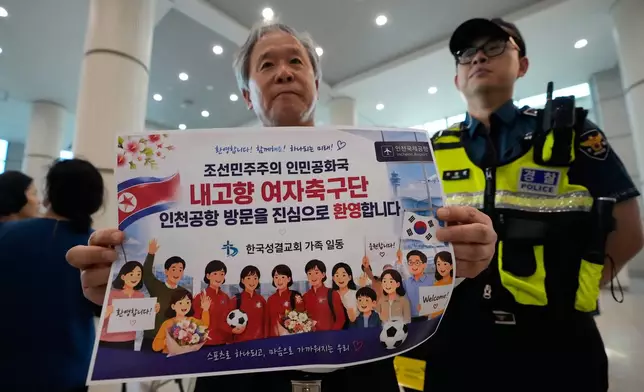 A South Korean activist waits for arrival of North Korean soccer club Naegohyang Women's FC team at Incheon International Airport in Incheon, South Korea, Sunday, May 17, 2026. The letters read "Welcome North Korean soccer club Naegohyang Women soccer." (AP Photo/Ahn Young-joon)