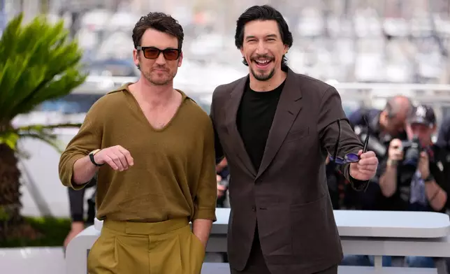 Miles Teller, left, and Adam Driver pose for photographers at the photo call for the film 'Paper Tiger' during the 79th international film festival, Cannes, southern France, Sunday, May 17, 2026. (AP Photo/John Locher)