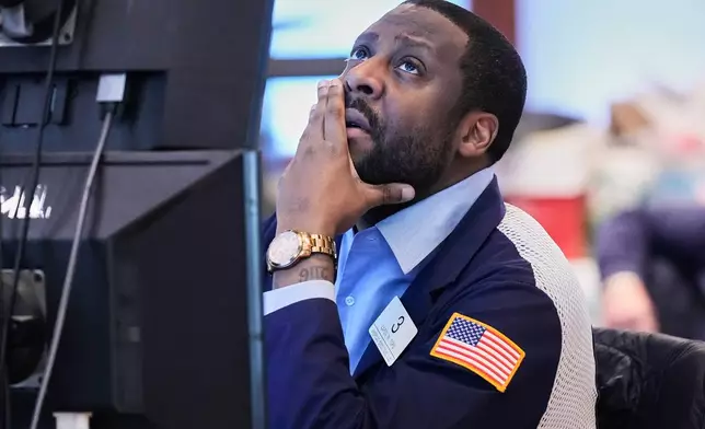 Trader Aaron Ford works on the floor of the New York Stock Exchange, Thursday, May 7, 2026. (AP Photo/Richard Drew)