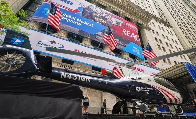 A Global Medical Response helicopter sits in front of the New York Stock Exchange before the planned IPO of GMR Solutions, Inc., Wednesday, May 13, 2026. (AP Photo/Richard Drew)