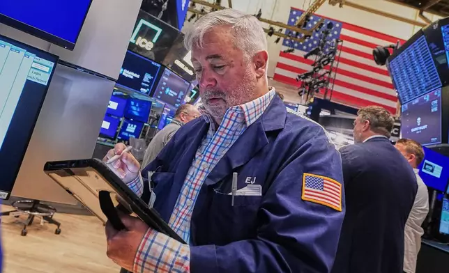 Trader Edward McCarthy works on the floor of the New York Stock Exchange, Wednesday, May 13, 2026. (AP Photo/Richard Drew)