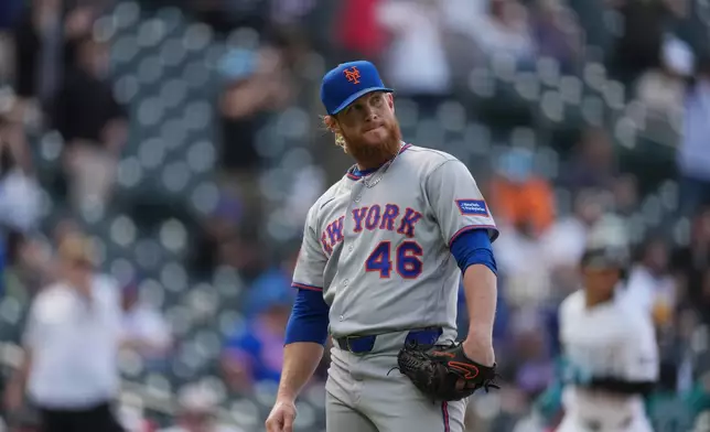 New York Mets relief pitcher Craig Kimbrel reacts after giving up a grand slam to Colorado Rockies' Jake McCarthy in the eighth inning of a baseball game, Thursday, May 7, 2026, in Denver. (AP Photo/David Zalubowski)
