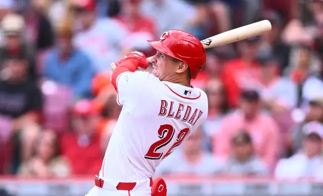 Cincinnati Reds' JJ Bleday (22) hits a three-run home run during the fifth inning of a baseball game against the Washington Nationals in Cincinnati, Thursday, May 14, 2026. (AP Photo/Ben Jackson)