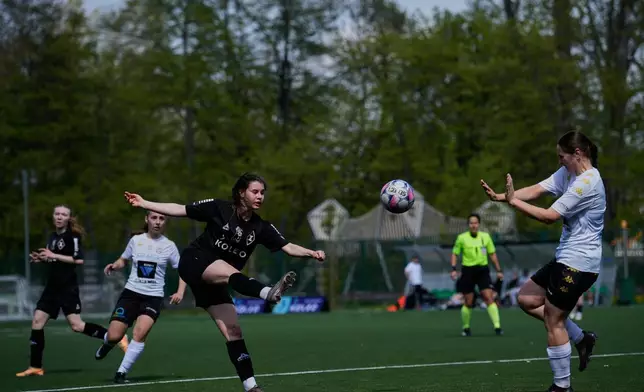 AKS Zly Praga's Natalia Pamieta shoots the ball during the Women's II Liga Kobiet North soccer match between AKS Zly Praga and KKP Slupczanka Slupca, at the Don Pedro Arena stadium in Warsaw, Poland, Saturday, April 25, 2026. (AP Photo/Ebrahim Noroozi)