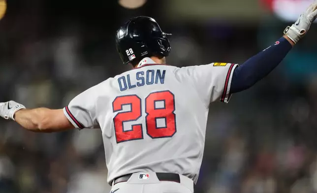 Atlanta Braves' Matt Olson gestures to the bullpen as he circles the bases after hitting a solo home run off Colorado Rockies relief pitcher Tanner Gordon in the ninth inning of a baseball game Saturday, May 2, 2026, in Denver. (AP Photo/David Zalubowski)