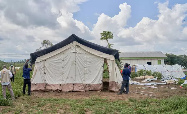 Aid workers set up an Ebola treatment center in Bunia, Congo, Tuesday, May 19, 2026. (AP Photo/Dirole Lotsima Dieudonne)
