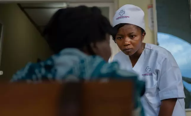 Dr Elizabeth Furaha, medical director of Karibuni wa Mama, speaks with a relative of a patient at Sofepadi Hospital in Bunia, Congo, Friday, May 29, 2026. (AP Photo/Moses Sawasawa)