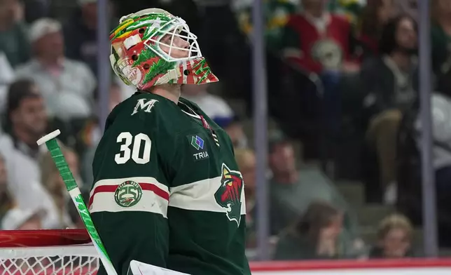 Minnesota Wild goaltender Jesper Wallstedt waits for play to resume after a goal by Colorado Avalanche center Nazem Kadri during the second period of Game 4 in an NHL Stanley Cup hockey second-round playoff series Monday, May 11, 2026, in St. Paul, Minn. (AP Photo/Abbie Parr)