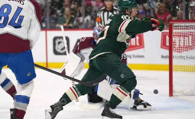 Minnesota Wild left wing Kirill Kaprizov (97) celebrates after a goal by Wild right wing Danila Yurov (not shown) during the first period of Game 4 in a second-round NHL hockey Stanley Cup playoff series against the Colorado Avalanche Monday, May 11, 2026, in St. Paul, Minn. (AP Photo/Abbie Parr)