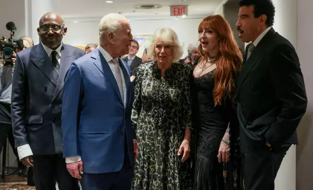 Edward Enninful, from left, Britain's King Charles III, Queen Camilla, Charlotte Tilbury and Lionel Richie attend a cultural reception Wednesday, April 29, 2026, in New York. (Spencer Platt/Pool via AP)