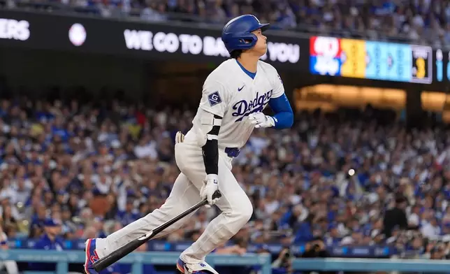 Los Angeles Dodgers' Shohei Ohtani heads to first for a solo home run during the third inning of a baseball game against the Philadelphia Phillies, Friday, May 29, 2026, in Los Angeles. (AP Photo/Mark J. Terrill)