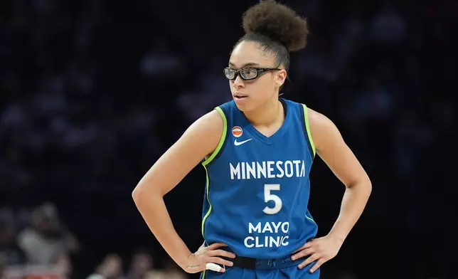 Minnesota Lynx guard Olivia Miles (5) stands on the court during the second half of a WNBA basketball game against the Toronto Tempo Thursday, May 21, 2026, in Minneapolis. (AP Photo/Abbie Parr)