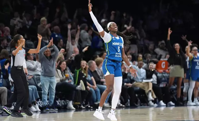 Minnesota Lynx guard Maya Caldwell (3) celebrates after making a 3-point shot during the second half of a WNBA basketball game against the Toronto Tempo Thursday, May 21, 2026, in Minneapolis. (AP Photo/Abbie Parr)