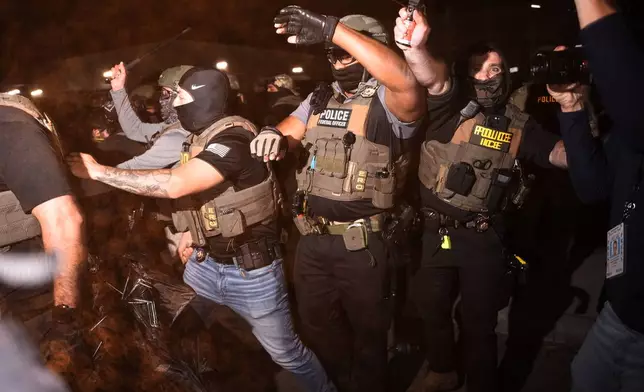 Federal immigration officers pepper spray protesters outside Delaney Hall detention center Thursday, May 28, 2026, in Newark, N.J. (AP Photo/Angelina Katsanis)