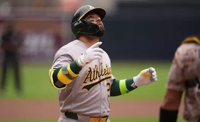 Athletics' Carlos Cortes celebrates after hitting a home run during the first inning of a baseball game against the San Diego Padres Sunday, May 24, 2026, in San Diego. (AP Photo/Gregory Bull)