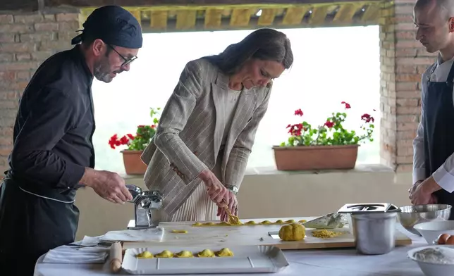 Britain's Kate, Princess of Wales prepares tortelli during her visit to the rural resort 'Al Vigneto', part of a two-day trip, in Reggio Emilia, Italy, Thursday, May 14, 2026. (AP Photo/Antonio Calanni, Pool)
