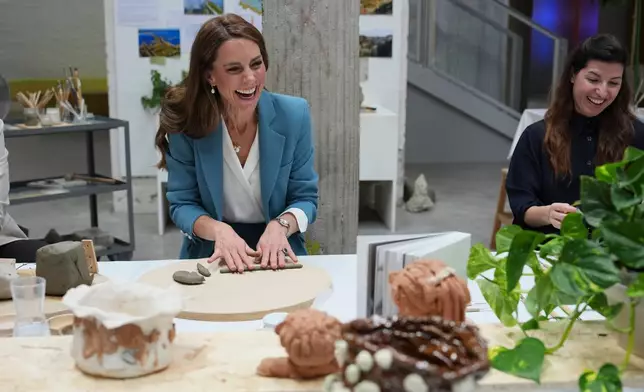 Britain's Kate, Princess of Wales, takes part in an immersive clay atelier workshop at the Loris Malaguzzi International Centre, part of a two-day trip, in Reggio Emilia, Italy, Wednesday, May 13, 2026. (AP Photo/Antonio Calanni, Pool)