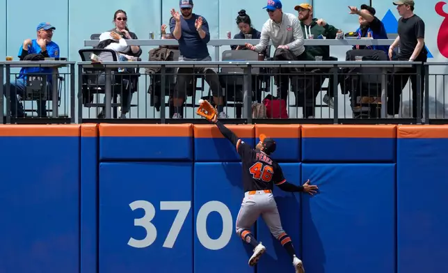 Detroit Tigers center fielder Wenceel Perez (46) fails to catch a two-run home run ball hit by New York Mets' Brett Baty during the fourth inning of a baseball game, Thursday, May 14, 2026, in New York. (AP Photo/Yuki Iwamura)