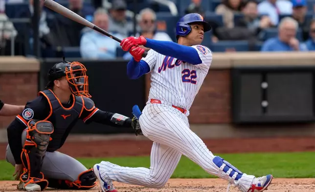 New York Mets designated hitter Juan Soto (22) hits a home run during the seventh inning of a baseball game against the Detroit Tigers, Thursday, May 14, 2026, in New York. (AP Photo/Yuki Iwamura)
