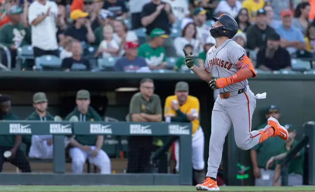 San Francisco Giants' Casey Schmitt runs the bases after hitting a home run during the first inning of a baseball game against the Athletics, Saturday, May 16, 2026, in West Sacramento, Calif. (AP Photo/Sara Nevis)