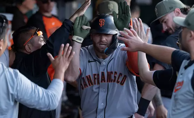 San Francisco Giants' Casey Schmitt celebrates after hitting a home run during the first inning of a baseball game against Athletics, Saturday, May 16, 2026, in West Sacramento, Calif. (AP Photo/Sara Nevis)