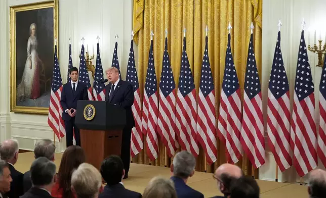 President Donald Trump speaks before Kevin Warsh, left, is sworn in as Chairman of the Federal Reserve, in the East Room of the White House, Friday, May 22, 2026, in Washington. (AP Photo/Manuel Balce Ceneta)