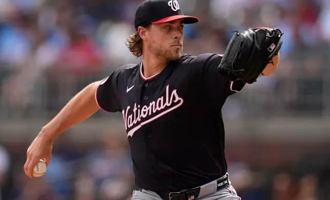 Washington Nationals pitcher Jake Irvin works in the first inning of a baseball game against the Atlanta Braves, Saturday, May 23, 2026, in Atlanta. (AP Photo/Mike Stewart)