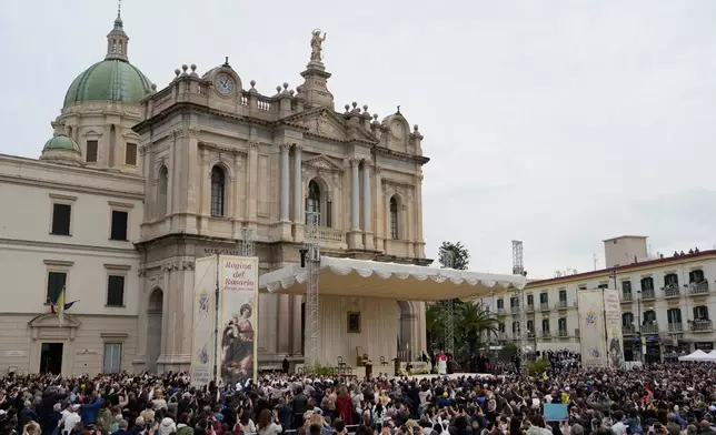 Pope Leo XIV greets the faithful in front of the Pompeii Shrine during his pastoral visit in Pompeii, Italy, Friday, May 8, 2026. (AP Photo/Gregorio Borgia)