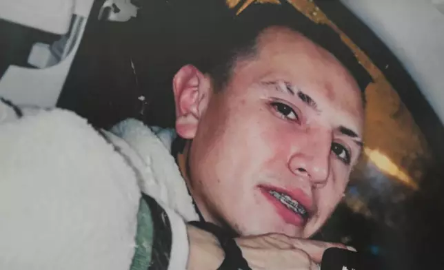 A photo of Brayan Rayo Garzon who died by suicide while in ICE custody in April 2025, is displayed in his mother's apartment in St. Louis, on Friday, May 1, 2026. (AP Photo/Nick Ingram)