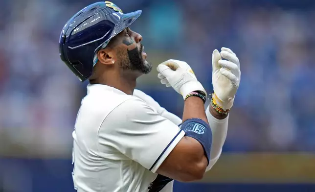 Tampa Bay Rays' Yandy Díaz celebrates his solo home run off Los Angeles Angels pitcher Walbert Ureña during the first inning of a baseball game Friday, May 29, 2026, in St. Petersburg, Fla. (AP Photo/Chris O'Meara)