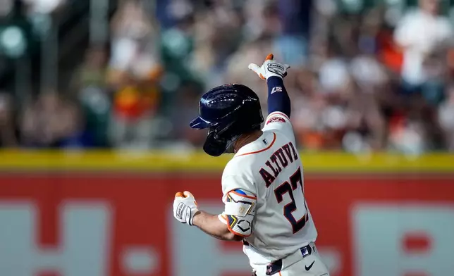 Houston Astros' Jose Altuve runs the bases after hitting a home run during the first inning of a baseball game against the Texas Rangers, Saturday, May 16, 2026, in Houston. (AP Photo/Kevin M. Cox)