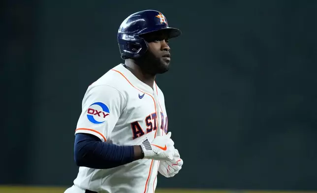 Houston Astros designated hitter Yordan Alvarez runs the bases after hitting a home run during the first inning of a baseball game against the Texas Rangers, Saturday, May 16, 2026, in Houston. (AP Photo/Kevin M. Cox)
