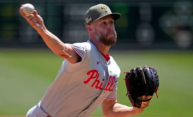 Philadelphia Phillies pitcher Zack Wheeler delivers during the first inning of a baseball game against the Pittsburgh Pirates in Pittsburgh, Sunday, May 17, 2026. (AP Photo/Gene J. Puskar)