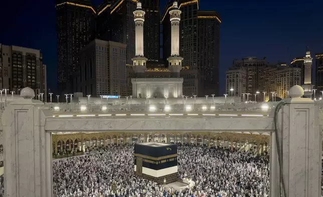 Muslim pilgrims perform the farewell circumambulation called Tawaf al-Wada, around the Kaaba, Islam's holiest site, at the Grand Mosque during the final rites of the annual Hajj pilgrimage in Mecca, Saudi Arabia, Friday, May 29, 2026. (AP Photo/Altaf Qadri)