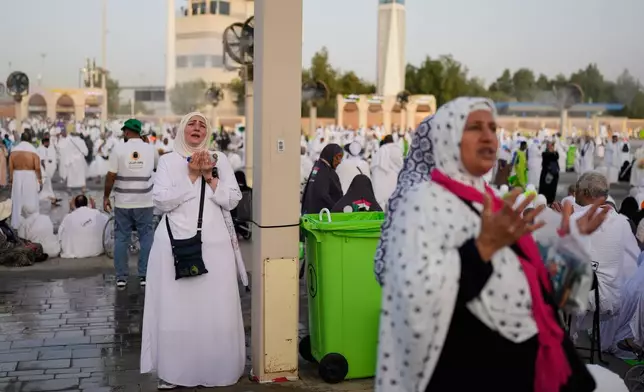 s pray in front of the rocky hill known as Mountain of Mercy, on the Plain of Arafat, during the annual Hajj pilgrimage near the holy city of Mecca, Saudi Arabia, Tuesday, May 26, 2026. (AP Photo/Altaf Qadri)