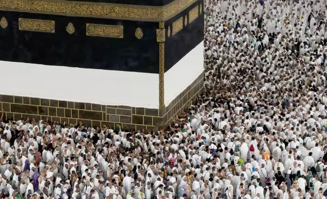 Muslim pilgrims circumambulate the Kaaba, Islam's holiest site at the Grand Mosque, during the annual Hajj pilgrimage in Mecca, Saudi Arabia, Friday, May 22, 2026. (AP Photo/Altaf Qadri)