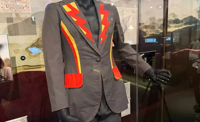 A costume sits on a mannequin inside the Paul McCartney and WINGS exhibit at the Rock Roll Hall of Fame on Thursday, May 14, 2026, in Cleveland, Ohio. (AP Photo/Patrick Aftoora-Orsagos)