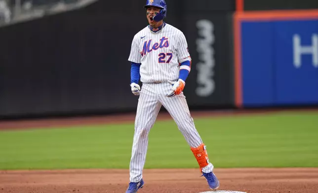 New York Mets' Mark Vientos (27) celebrates after hitting an RBI double during the sixth inning of a baseball game Washington Nationals Thursday, April 30, 2026, in New York. (AP Photo/Frank Franklin II)