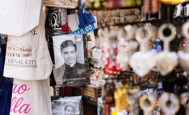 The 'Calendario Romano' calendar, bearing a photo of Giovanni Galizia, who is not a priest, is on sale in a souvenir shop in Rome, Wednesday, May 20, 2026. (AP Photo/Alessandra Tarantino)