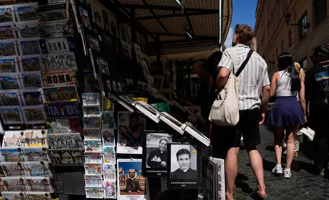The 'Calendario Romano' calendar, bearing a photo of Giovanni Galizia, who is not a priest, is on sale in a souvenir shop in Rome, Wednesday, May 20, 2026. (AP Photo/Alessandra Tarantino)