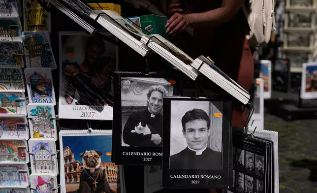 The 'Calendario Romano' calendar, bearing a photo of Giovanni Galizia, who is not a priest, is on sale in a souvenir shop in Rome, Wednesday, May 20, 2026. (AP Photo/Alessandra Tarantino)