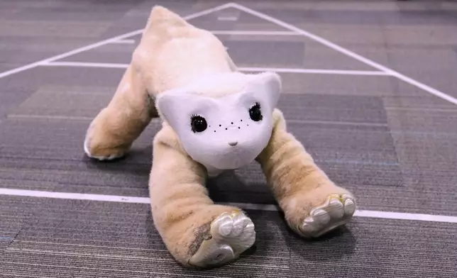 Familiar, an AI pet robot, interacts during a demonstration at the Massachusetts-based startup Familiar Machines &amp; Magic, Wednesday, April 29, 2026, in Woburn, Mass. (AP Photo/Charles Krupa)