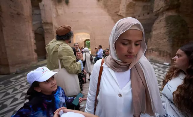 Nashwa Alnajjar takes part in a visit to Rome's Baths of Caracalla offered by the "Guides for Gaza" association to around 50 Palestinian refugees who arrived in Italy from the Gaza Strip through humanitarian corridors due to serious medical reasons, Sunday, May 3, 2026, in Rome. (AP Photo/Andrew Medichini)
