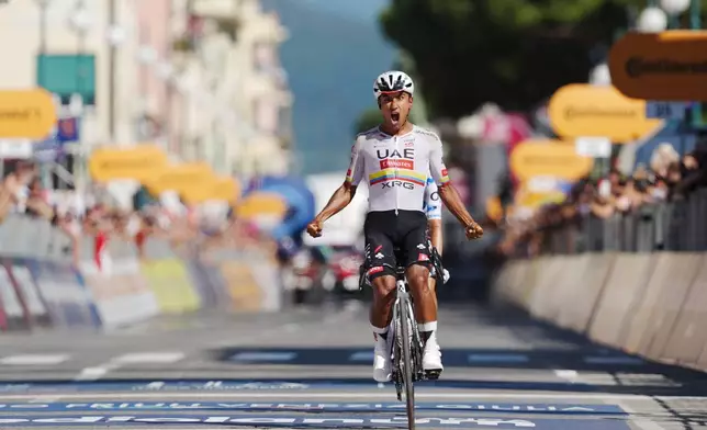 Ecuador's Manuel Jhonatan Narvaez celebrates winning the 11th stage of the Giro d'Italia cycling race, from Porcari to Chiavari, Italy, Wednesday May 20, 2026. (Massimo Paolone/LaPresse via AP)