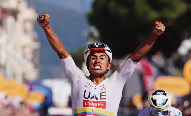 Ecuador's Manuel Jhonatan Narvaez celebrates winning the 11th stage of the Giro d'Italia cycling race, from Porcari to Chiavari, Italy, Wednesday May 20, 2026. (Gianmattia D'Alberto/LaPresse via AP)