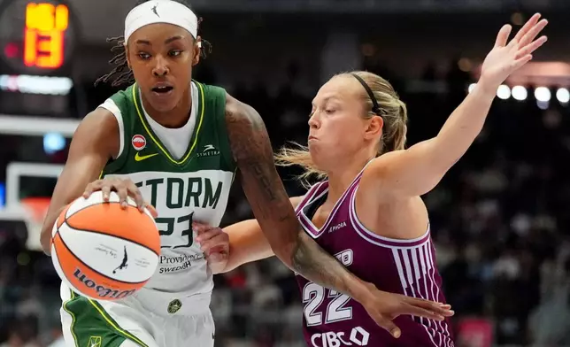Toronto Tempo guard Julie Allemand, right, defends against Seattle Storm forward Jordan Horston during the first half of a WNBA basketball game in Toronto, Saturday, May 30, 2026. (Frank Gunn/The Canadian Press via AP)