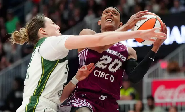 Seattle Storm forward Katie Lou Samuelson (33) fouls Toronto Tempo guard Brittney Sykes (20) on her way to the net during the second half of a WNBA basketball game in Toronto, Saturday, May 30, 2026. (Frank Gunn/The Canadian Press via AP)