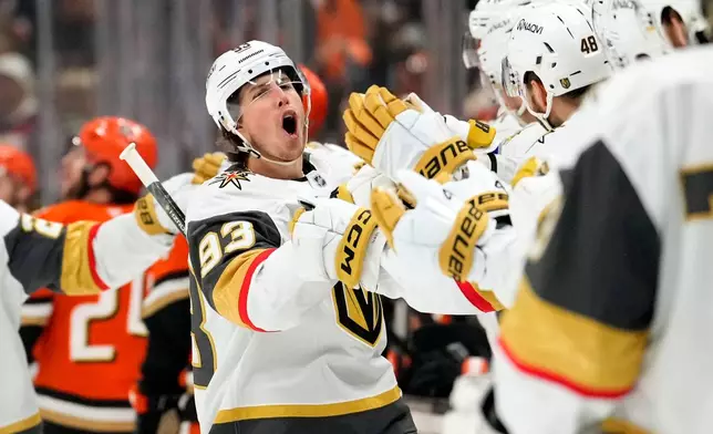 Vegas Golden Knights right wing Mitch Marner, second from left, celebrates his goal with teammates during the first period in Game 6 of a second-round NHL hockey Stanley Cup playoff series against the Anaheim Ducks, Thursday, May 14, 2026, in Anaheim, Calif. (AP Photo/Mark J. Terrill)