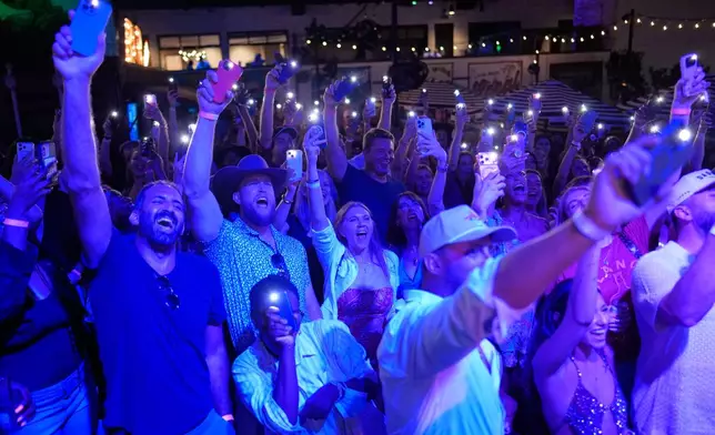 Attendees cheer during a Tall Tour event Saturday, May 9, 2026, in Austin, Texas. (AP Photo/David J. Phillip)