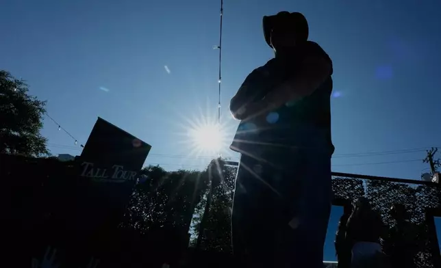 Sam Koban, who is 7 feet, 3 inches tall stands outside during a Tall Tour event Saturday, May 9, 2026, in Austin, Texas. (AP Photo/David J. Phillip)